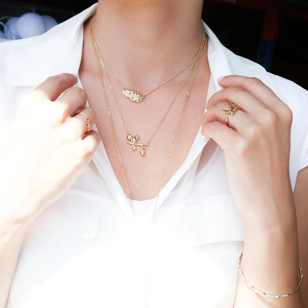 Short Gold Feather Necklace by Short Story